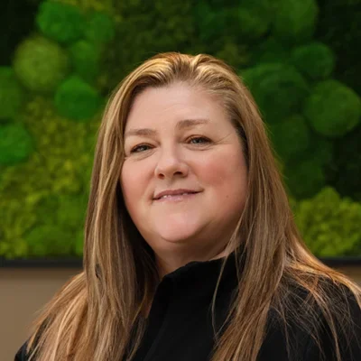 A headshot photo of Michele