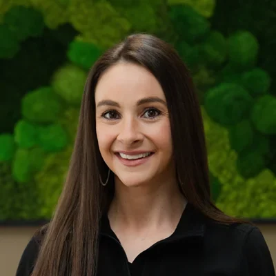 A headshot photo of Tara